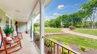 This could be your new front porch.  The railings and post were recently upgraded. Perfect spot for a porch swing?  Hooks are already in place!