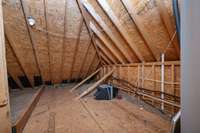 There's also this floored attic space off the bonus room upstairs.