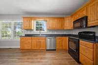 Deep, single basin sink, new stainless dishwasher and deep cabinet drawers.