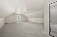 This spacious room is 27x20 and features new carpet, ceiling fan, neutral paint and a window overlooking the front yard.