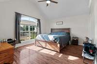 Master Bedroom offers LVP flooring, fresh paint, new ceiling fan and double windows