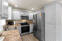 Freshly painted cabinets with lots of room for storage