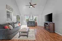 Living room is spacious with a new ceiling fan and luxury vinyl flooring