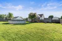 A view of the back of the home.  Large spacious Backyard with many possibilities.