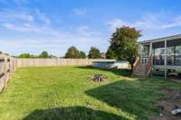 A view of the side of the house.  Fence is only 5 years old