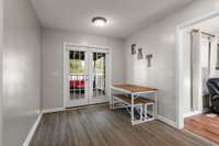 Spacious Eat-In area.  The double doors lead out to the spacious deck and large back yard