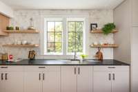 These countertops are Leathered Via Lactea granite.