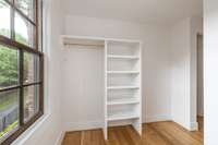 Downstairs primary walk-in closet