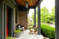 Enjoy relaxing on the wide covered front porch overlooking a quiet street.