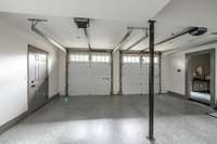 2 car attached garage with epoxy flooring