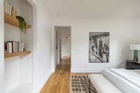 Walk down your private hallway to the primary bathroom and walk-in closet.