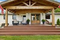 Cedar wrapped front porch offering gorgeous sunset views and the perfect place to unwind