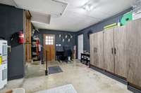 Originally a two car garage with pedestrian door; easily converted back to garage if desired