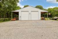 Fabulous 30x40 Shop with two overhangs & 16 foot roll up doors!