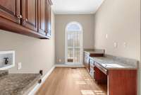 laundry room with granite counters