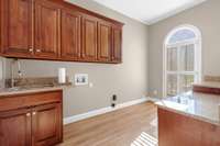 laundry with lot of storage cabinets and hook ups
