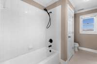 bathtub with new bronze shower