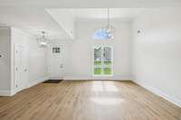 Two options for dining areas. This area has a 13 feet high ceiling and room for a table to seat 10 people!