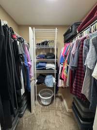 Primary bedroom walk-in closet