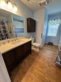 Full bath also with cork flooring.