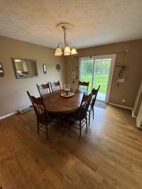 Spacious dining room area with another great view of the back yard.