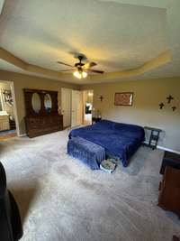 Primary bedroom and the other bedrooms are carpet however there is new 3/4" solid oak hardwood stacked in the family room that could be used for these bedrooms