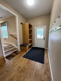 Entrance showing the front door that goes into the foyer of the in-law quarters.