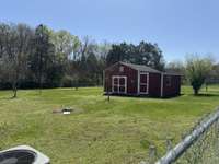 Storage building to remain. Great work shop.