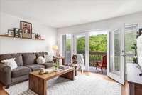 Fresh air fills the living space from the balcony. Green all around!