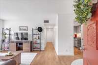 A neutral pallet welcomes you, along with warm new flooring.