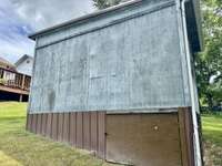 There is a door on the right side for storage underneath the shed
