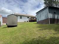There are 2 storage buildings remaining with the home. The front storage building does not remain with the home.