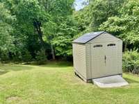 There is a small shed that remains with the home