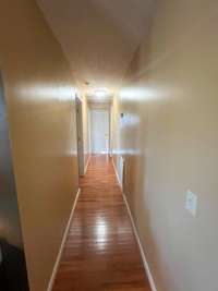 Hallway Leading To 3 Of The 4 Bedrooms!