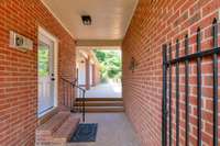 Gated entrance to breezeway between detached garage and home