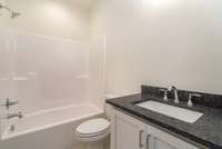 4th full bathroom is a private bath located in bedroom 5 upstairs.