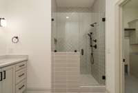 Primary bathroom has full tiled walk-in shower