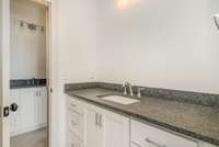 Third full bathroom is shared between bedrooms 3 and 4. Separate sinks and vanities, shared toilet and tub/shower combo