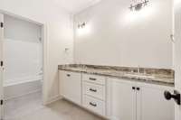 Full bathroom #3 is located in the hallway upstairs and has double vanities