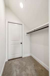Closet off bonus room has door to floored walk-in attic space.