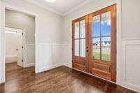 From the foyer, the hall leads to the second bedroom and full bathroom located downstairs