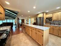 Ranch home with easy flow with hardwood, tile and vinyl floor coverings; no carpet