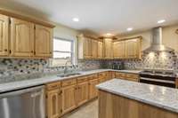 Custom cabinets in working kitchen with easy flowing for family gatherings