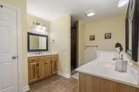 Primary Bath is tile flooring with tile shower; Double custom vanities;
