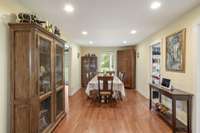 27x11 Dining Room with hardwood flooring, recessed lighting flows from the  Kitchen into the Living Room and Large Pantry & Laundry Room