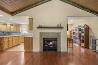 Living Room features a See Thru Gas Fireplace; Open area behind the fireplace can be used as an office/flex area.