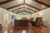 Family & Friends gatherings happen here in the 18x27 Living Room with hardwood flooring off from the large foyer; Open floor plan