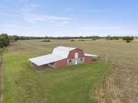Maintained barn located in field behind the house; Electricity is available.