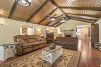 Living Room with hardwood flooring and large windows overlooking the covered front porch