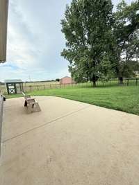 Enjoy the patio in the fenced back yard overlooking the backfield with the barn having the availability for electricity